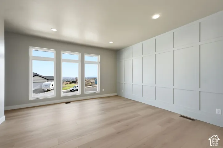 Large gathering room off the kitchen could be used as dining room or another family room.