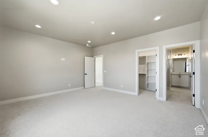 Large bedroom with walk in closet and en suite bathroom.