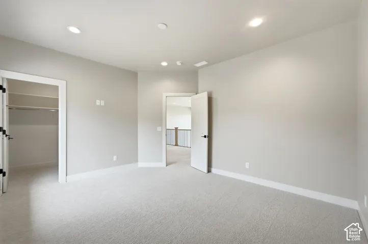 Oversized bedroom with walk in closet and lots of natural light