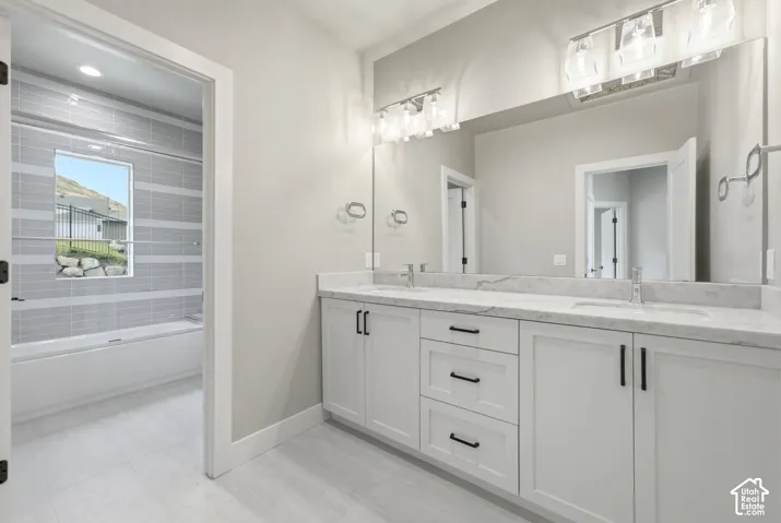 Spacious split bathroom for bedroom 3 & 4 to share features a double vanity and plenty of countertop space.