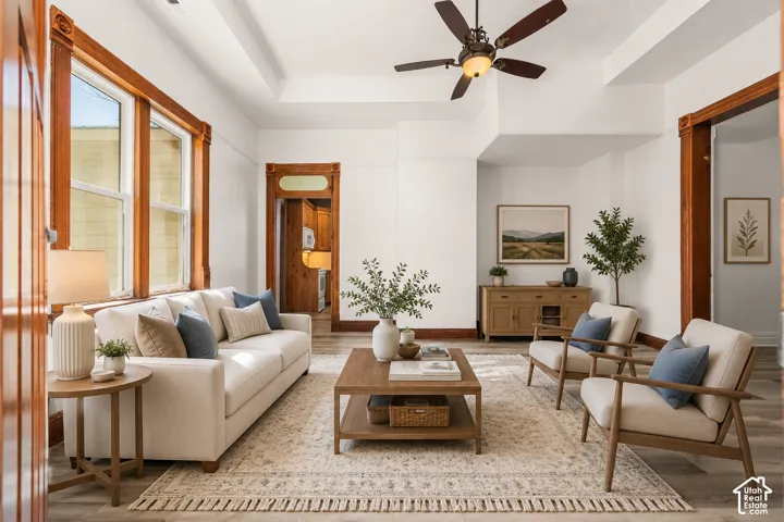 Living area featuring wood-finish flooring and white walls