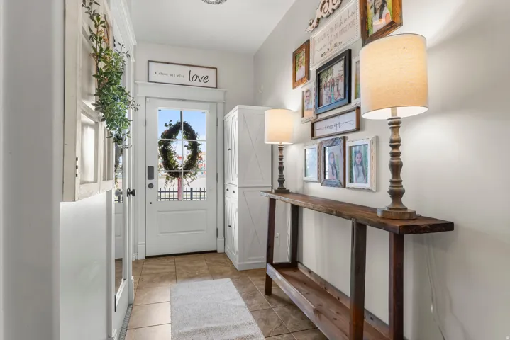 Foyer entrance featuring light tile patterned flooring