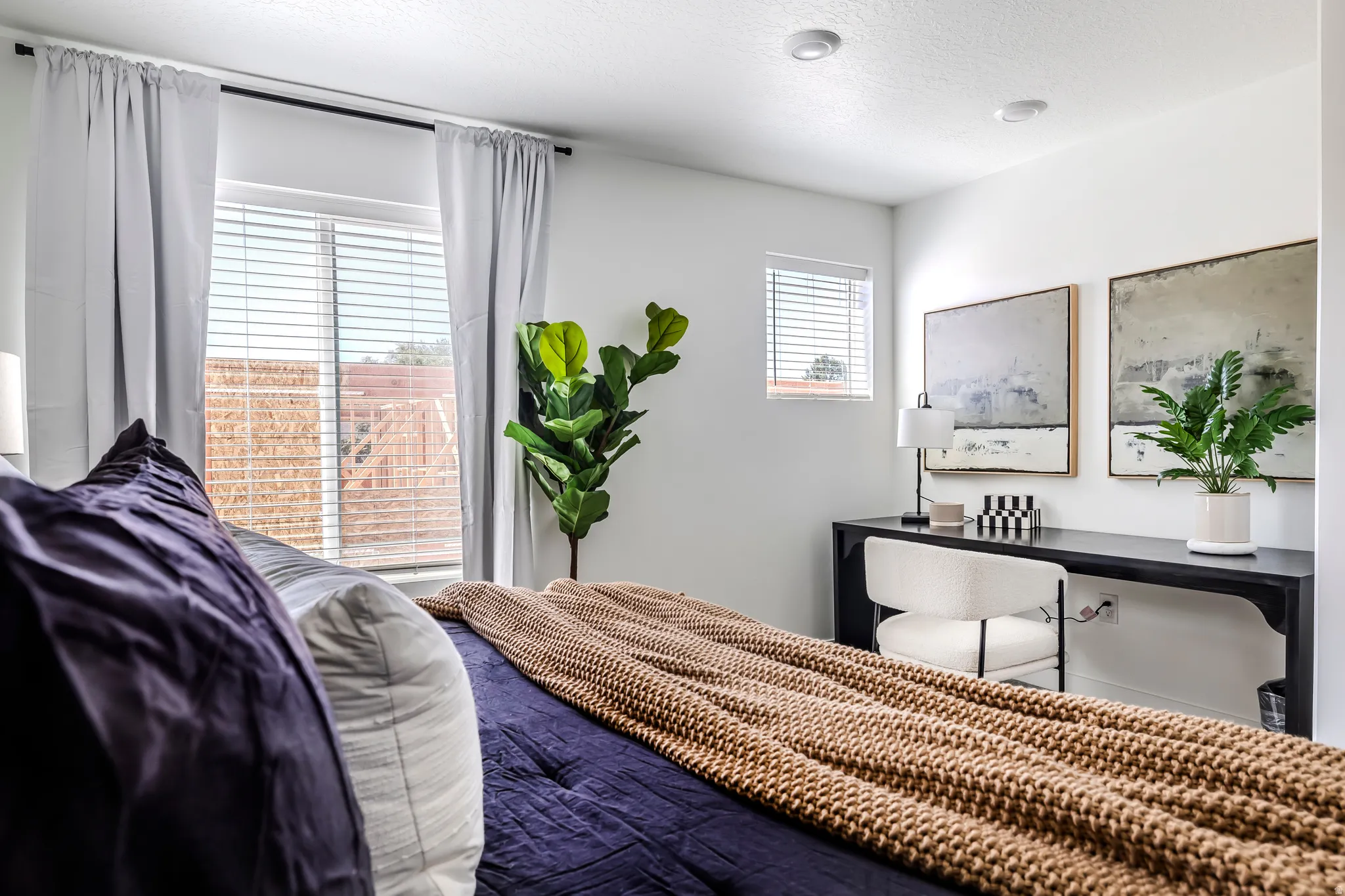 Bedroom with a textured ceiling
