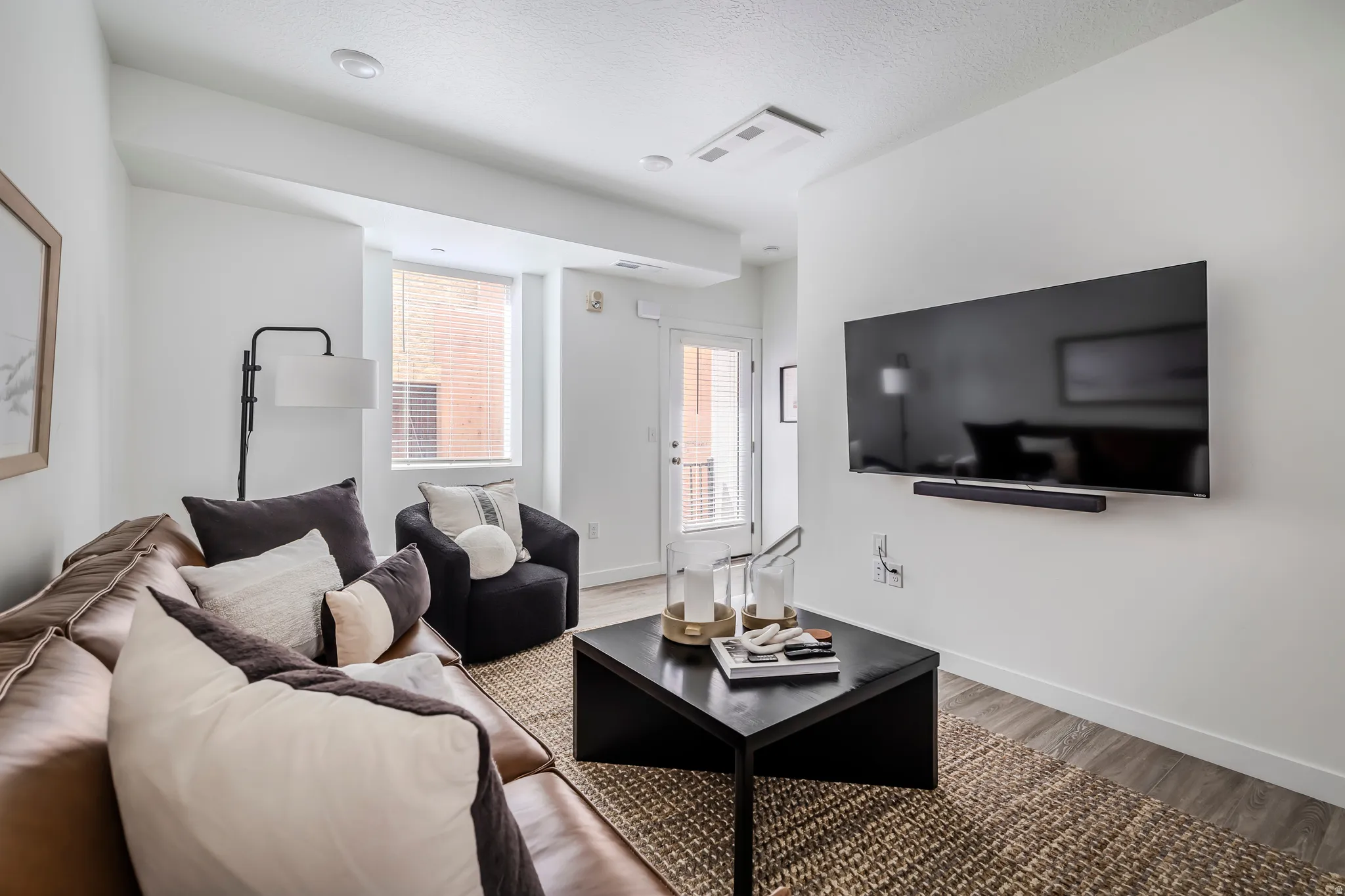 Living room with wood finished floors and baseboards