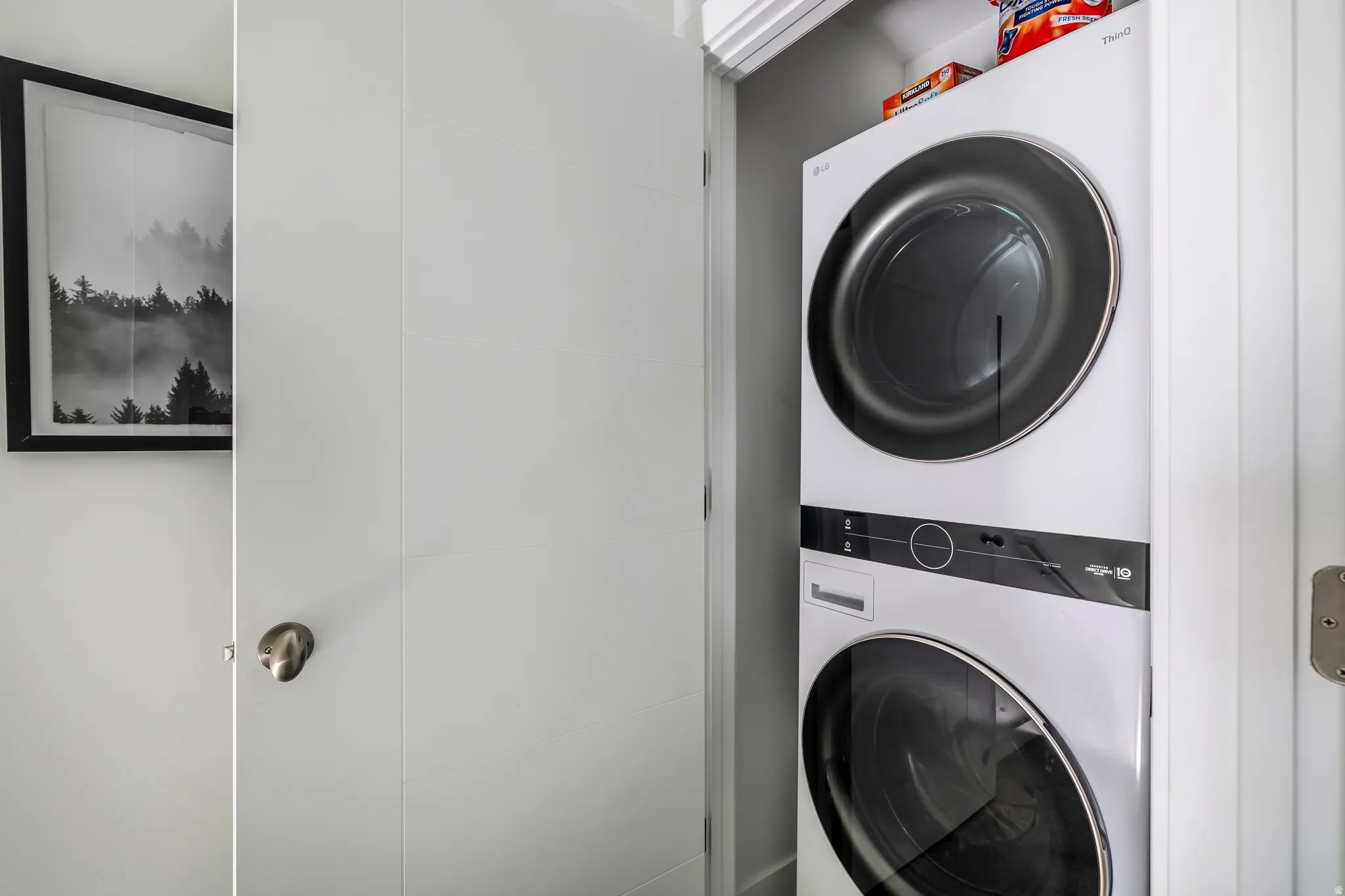 Laundry area with stacked washer / dryer