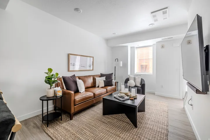 Living area featuring baseboards and light wood-style floors