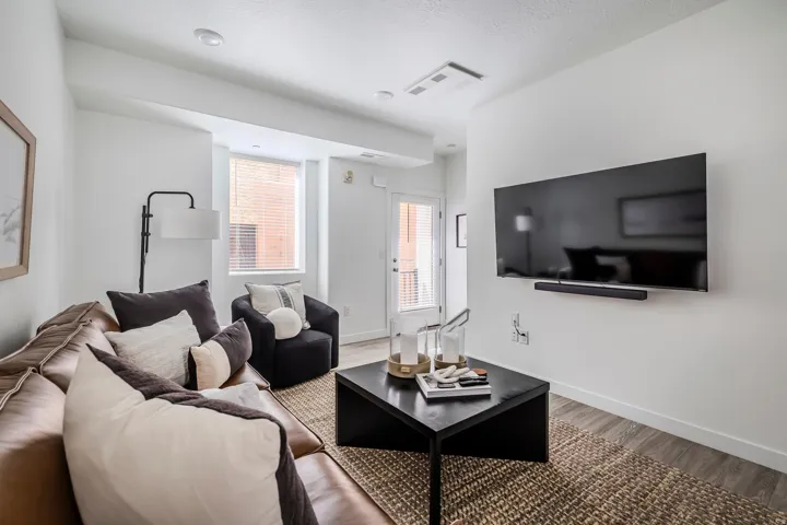 Living room with wood finished floors and baseboards