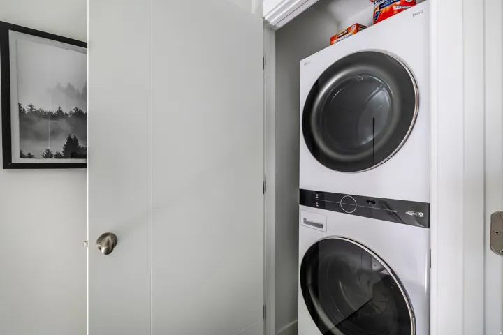 Laundry area with stacked washer / dryer