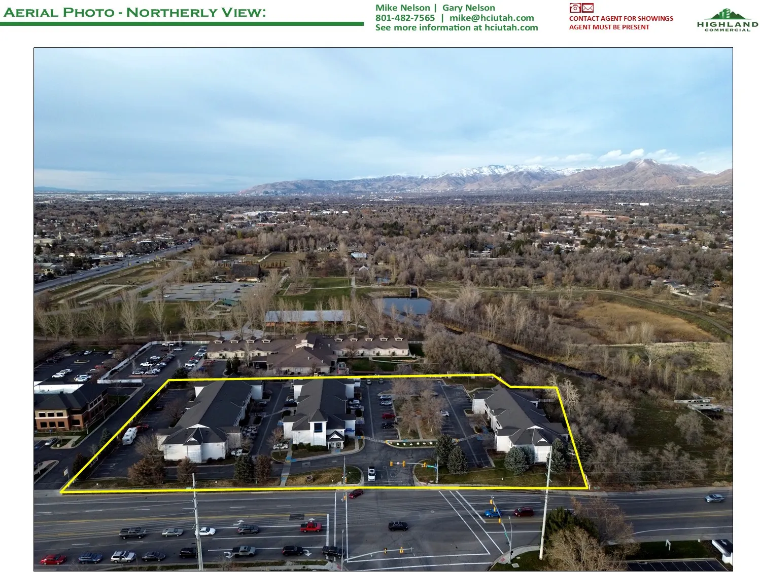 Aerial overview of property's location featuring property boundaries highlighted and a mountain backdrop