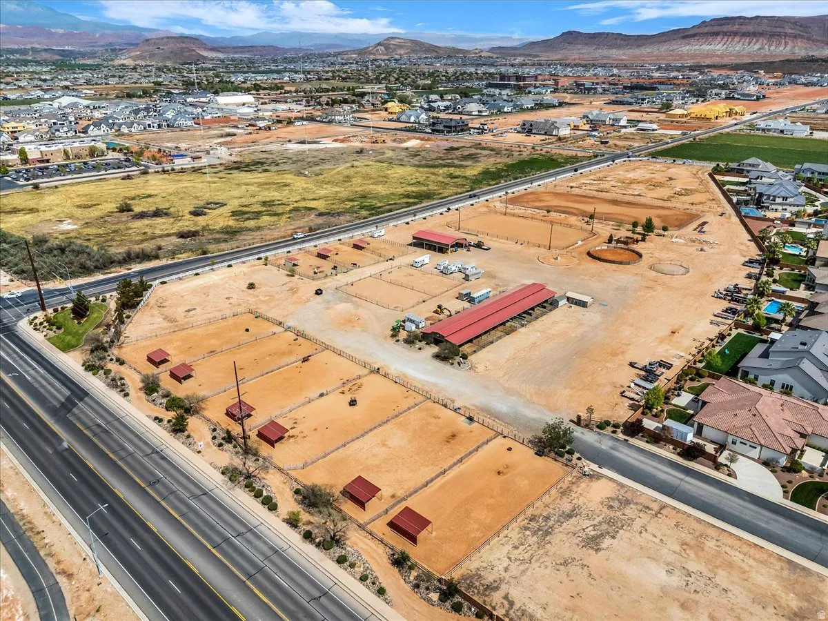 Aerial view of property's location featuring a mountain backdrop