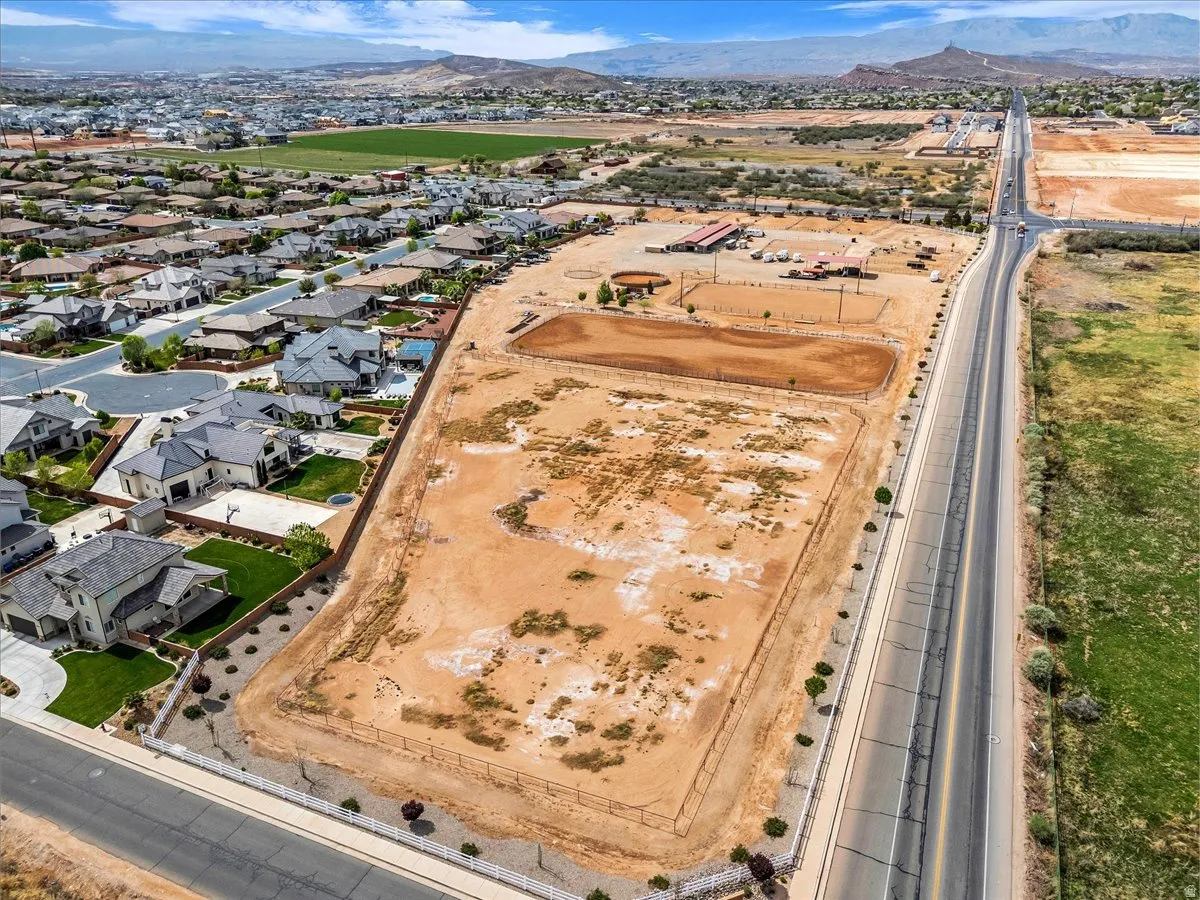 View of property location with mountains and nearby suburban area