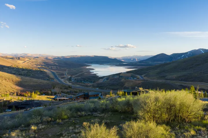 View of mountain backdrop with a nearby body of water