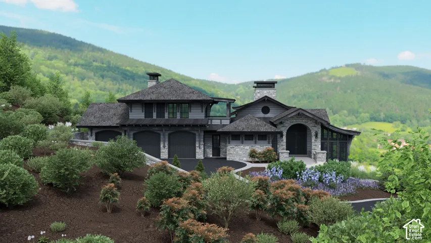 Contemporary multi-level residence featuring stone and wood siding, a prominent two-car garage, and a circular drive