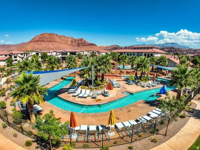 Community pool with a mountain view and a patio