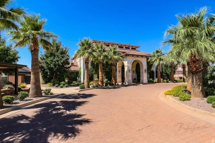 Mediterranean / spanish house featuring a tile roof and stucco siding