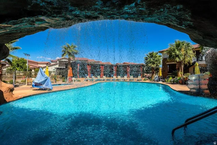 Community pool featuring a patio