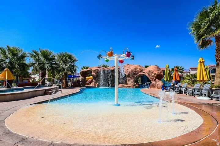 Community pool with a patio area