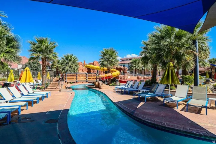 Community pool featuring a patio