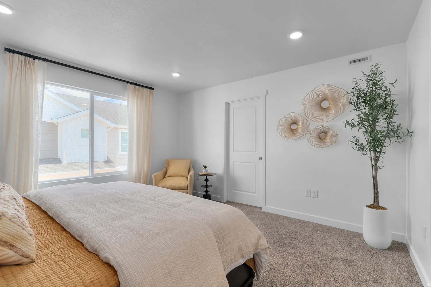 Carpeted bedroom with baseboards and recessed lighting