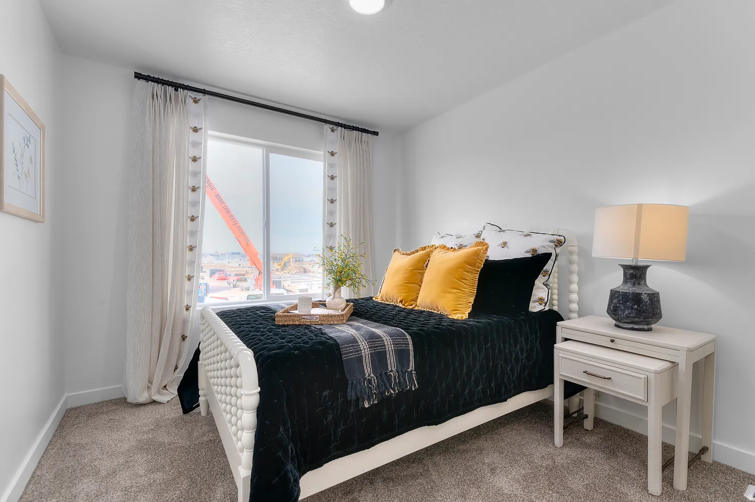 Bedroom with baseboards and light carpet