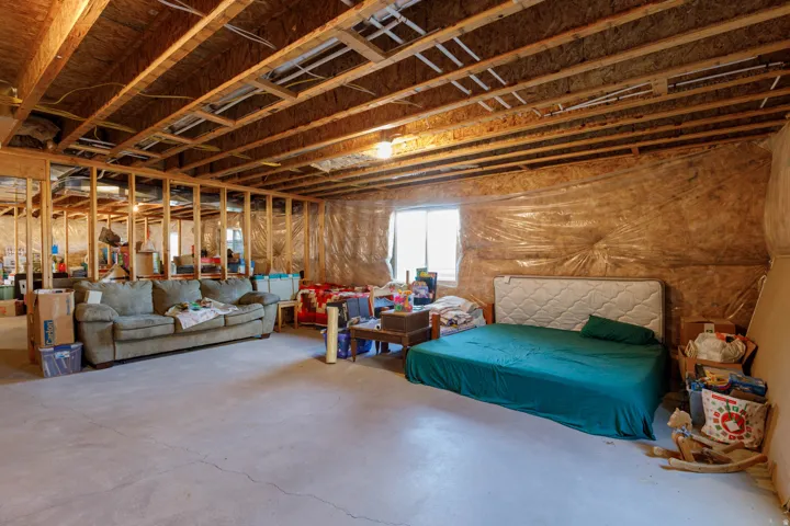 Bedroom with concrete floors