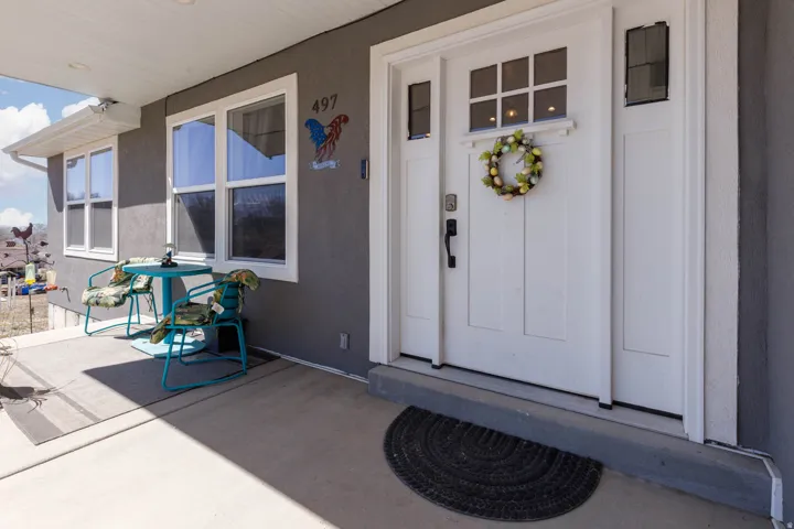 Property entrance with stucco siding