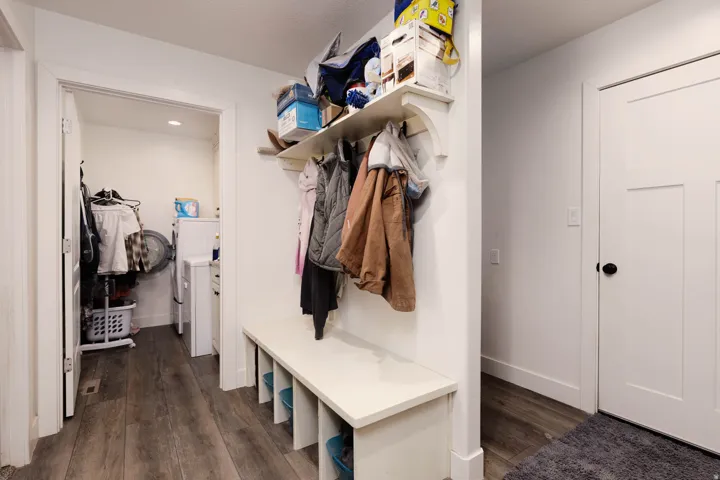 Mudroom with dark wood-type flooring and recessed lighting