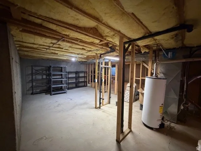 Unfinished basement with gas water heater