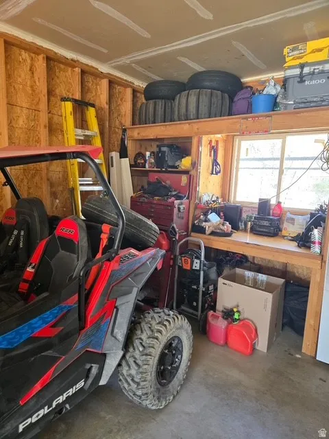 Garage featuring a workshop area