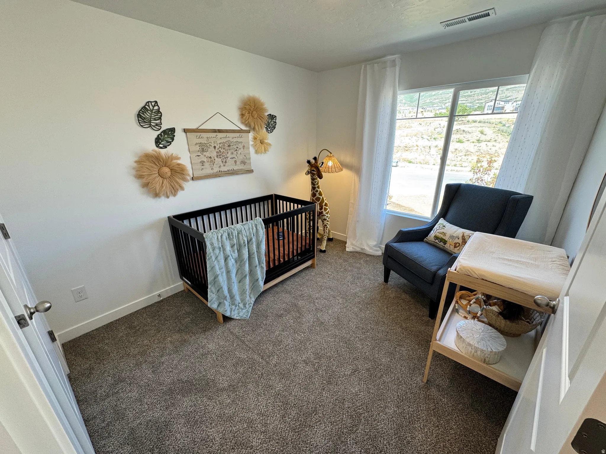 Room featuring neutral carpeting and white wall paint
