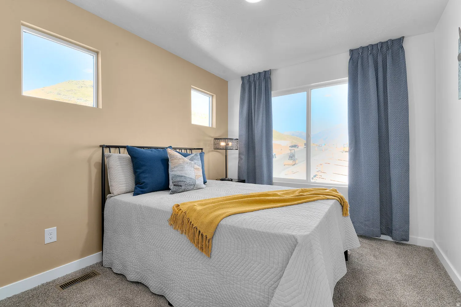 Bedroom featuring light carpet