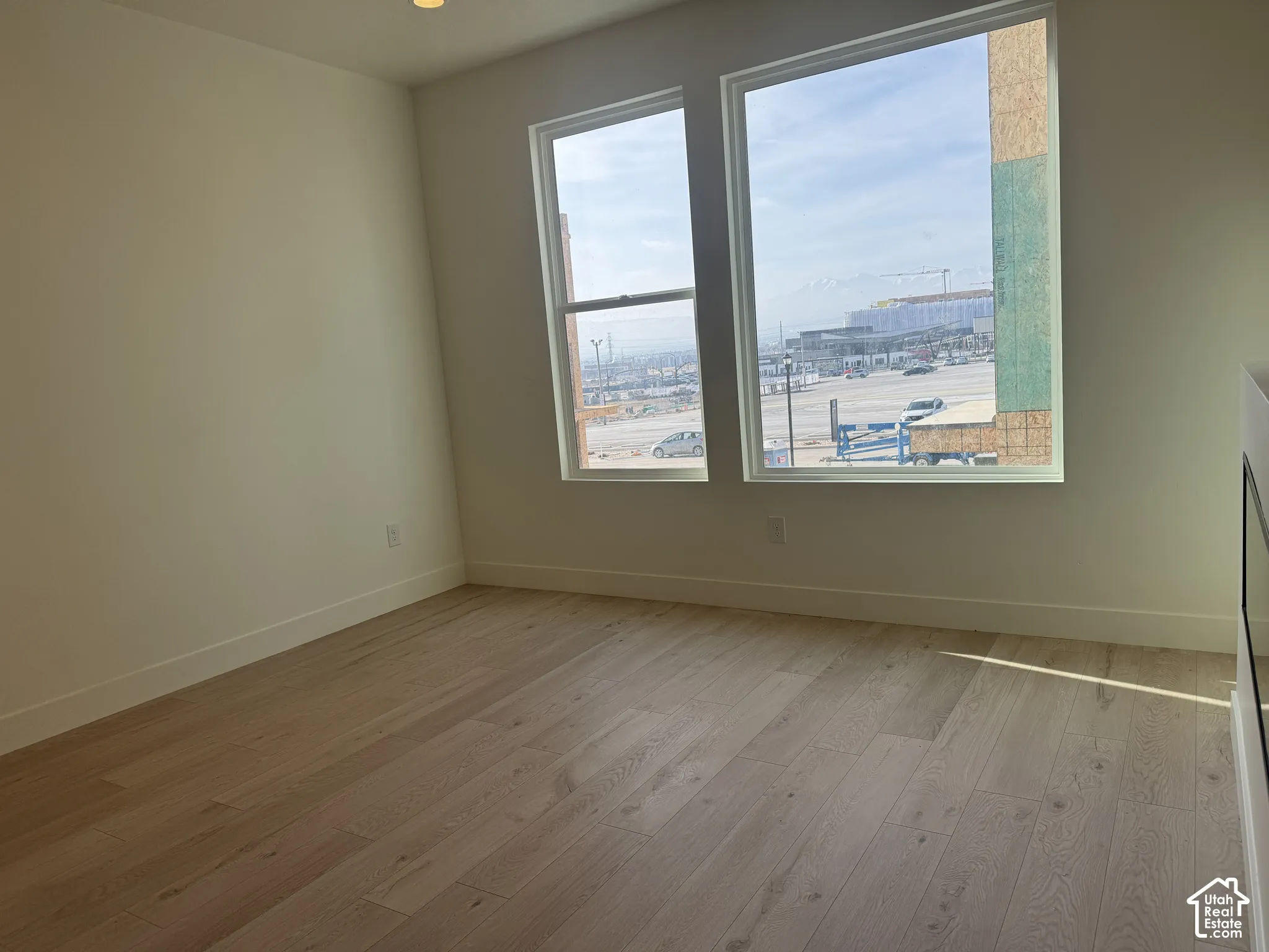 Spare room with light wood-type flooring and recessed lighting