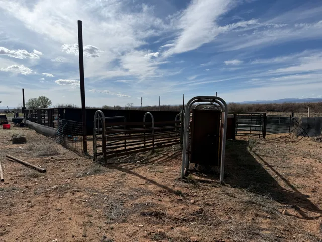 View of yard with an outdoor structure, an exterior structure, and a view of rural / pastoral area