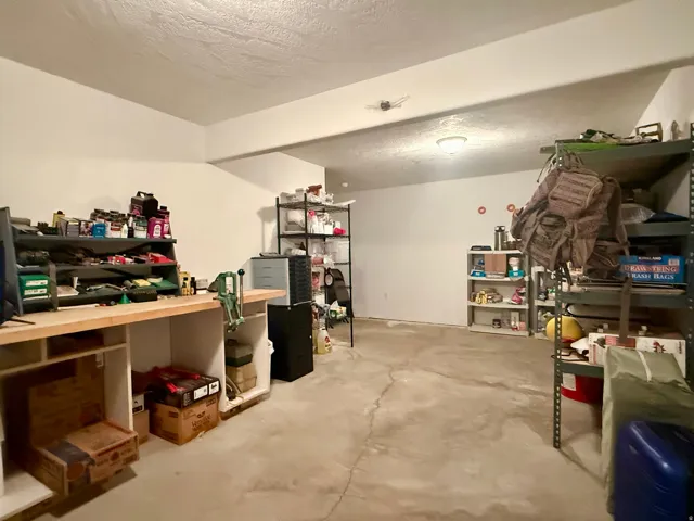 Basement with a textured ceiling