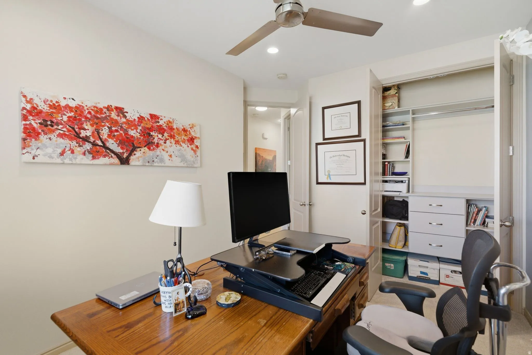 Office space with a ceiling fan and recessed lighting