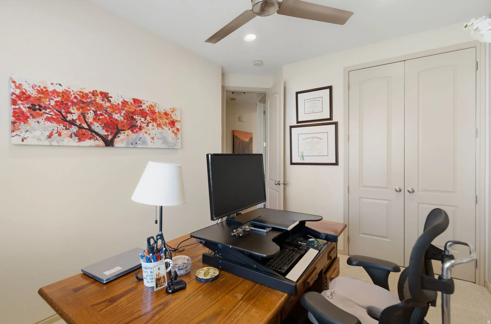 Office with ceiling fan and recessed lighting