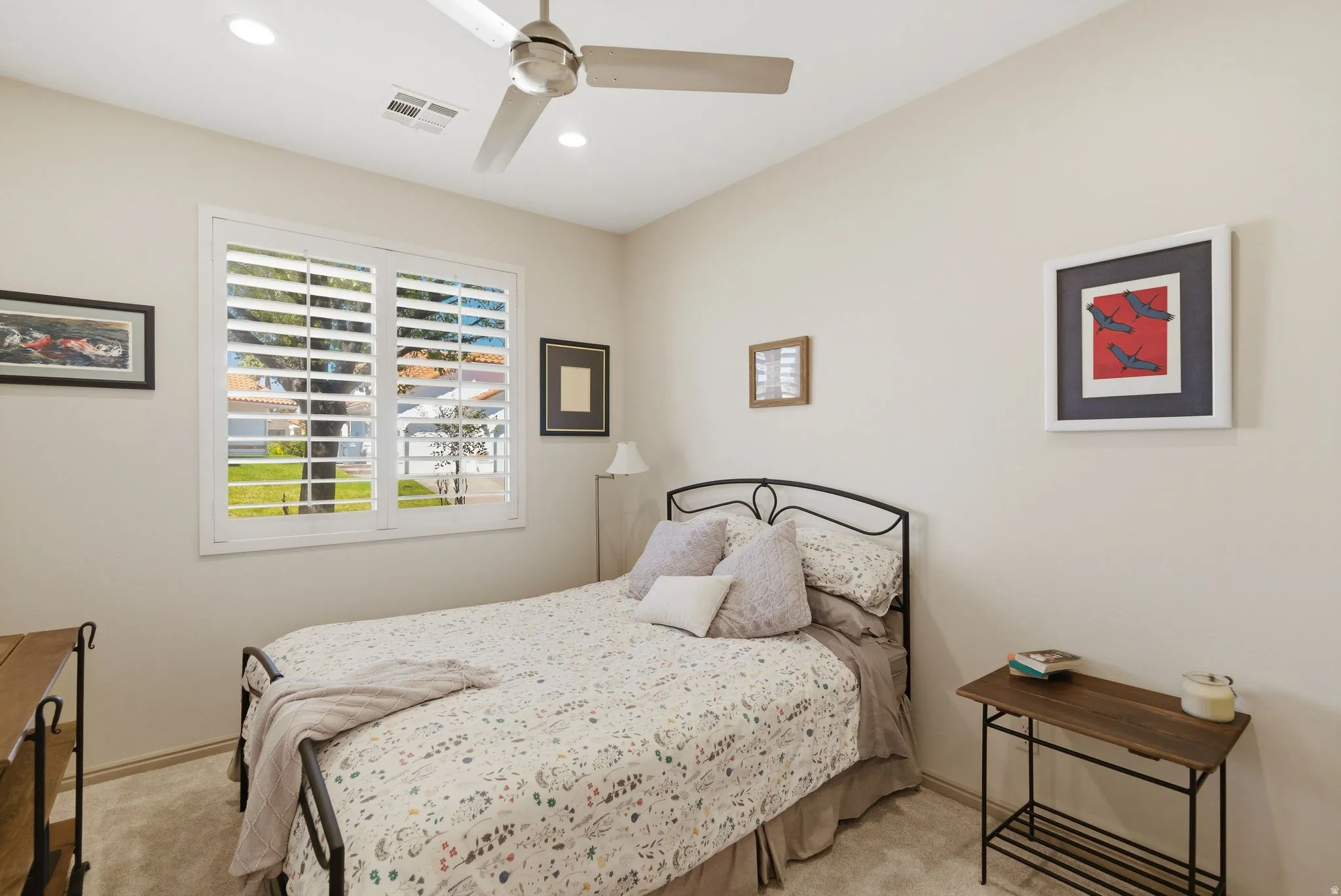 Bedroom with light carpet, a ceiling fan, and recessed lighting