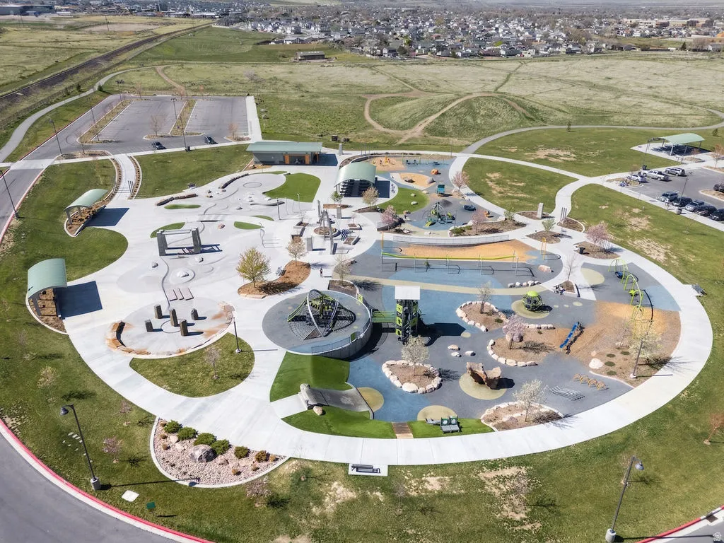 Aerial view of property and surrounding area with a community park