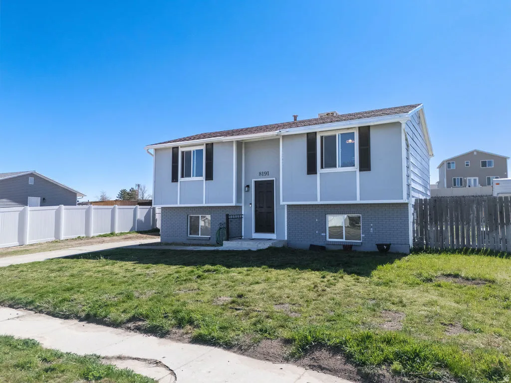Raised ranch with brick siding