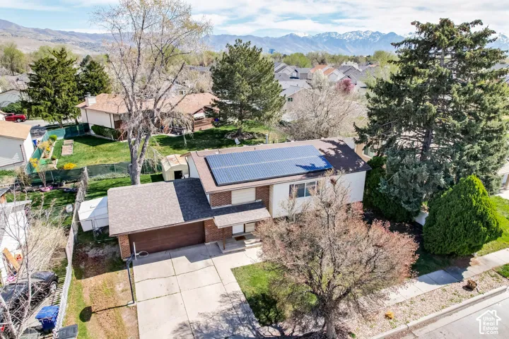 Aerial perspective of suburban area featuring a mountainous background