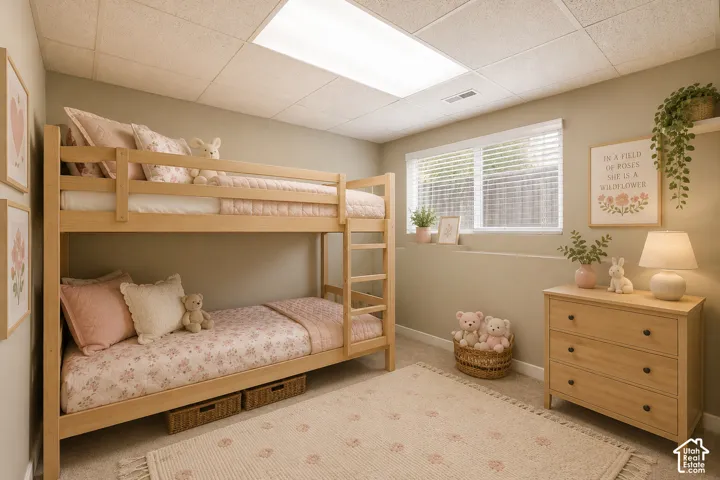 Room featuring a drop ceiling with recessed lighting, light-colored walls, and a window with blinds