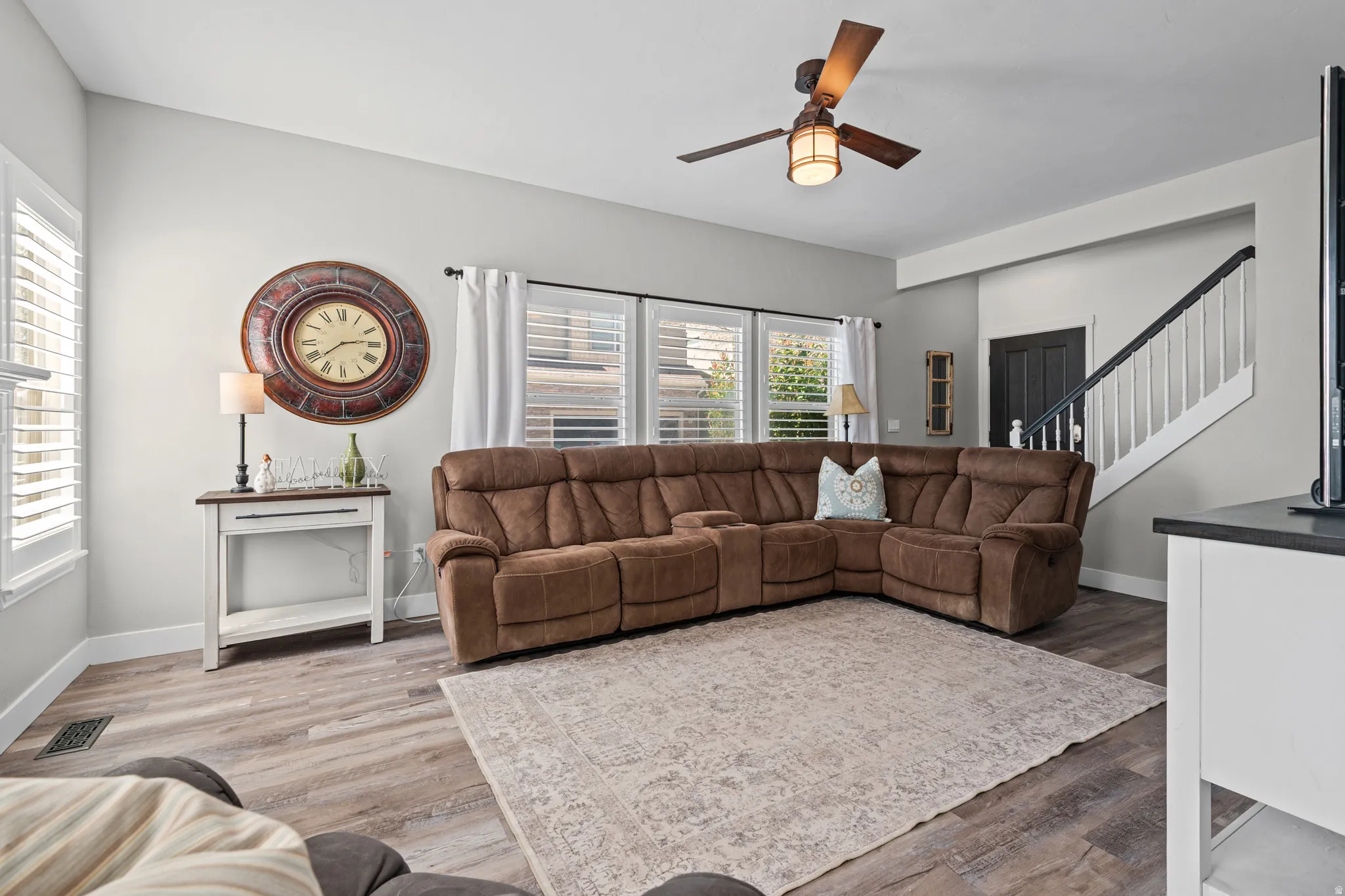 Living area featuring a ceiling fan and lvp floors