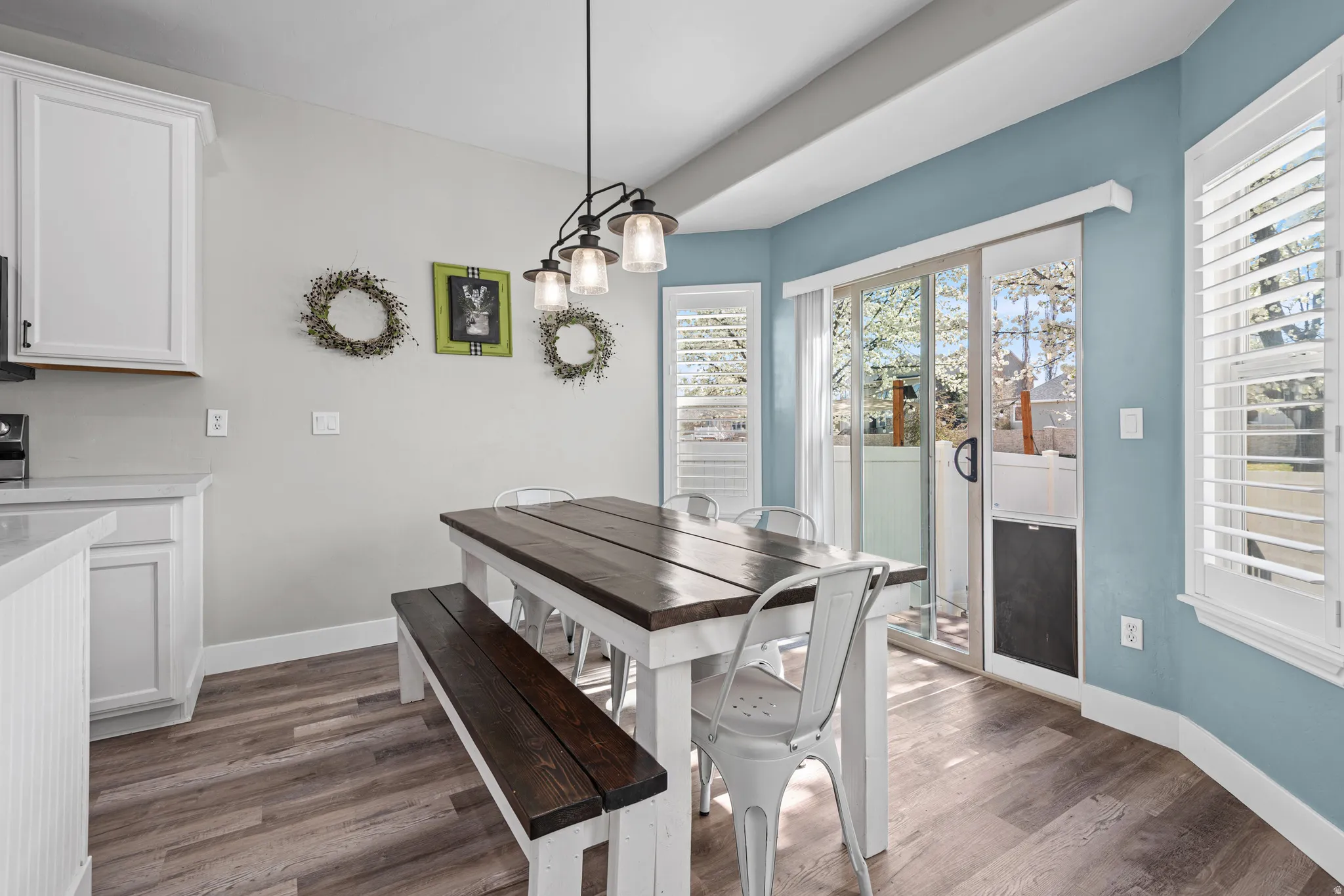 Dining area with dark wood-type flooring