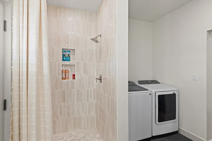 Rinse off shower to hang wet clothes from snow or rinse off pets. Door enters from back patio.