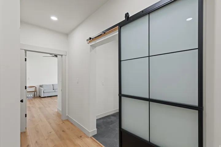 Entry from garage. Laundry is through the glass barn door. ADU apartment that can be locked off from main house is through open doorway.