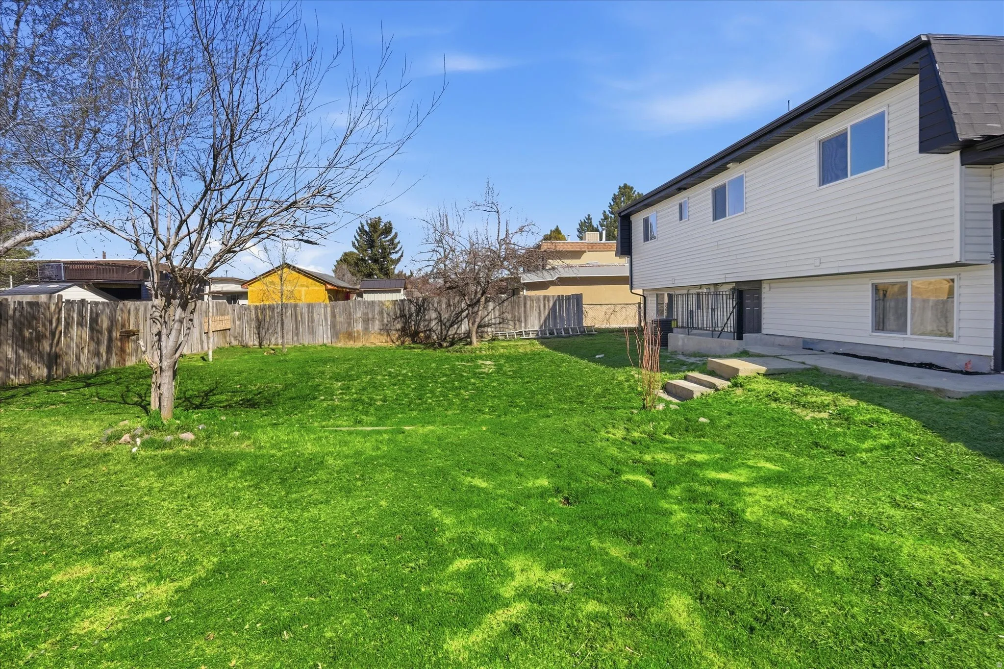 View of fenced backyard