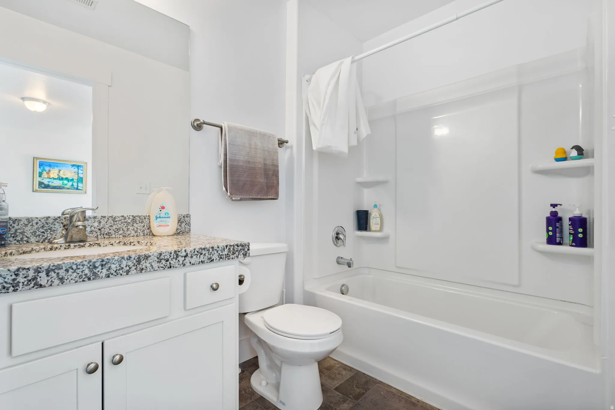 Full bath with vanity and shower / bathtub combination