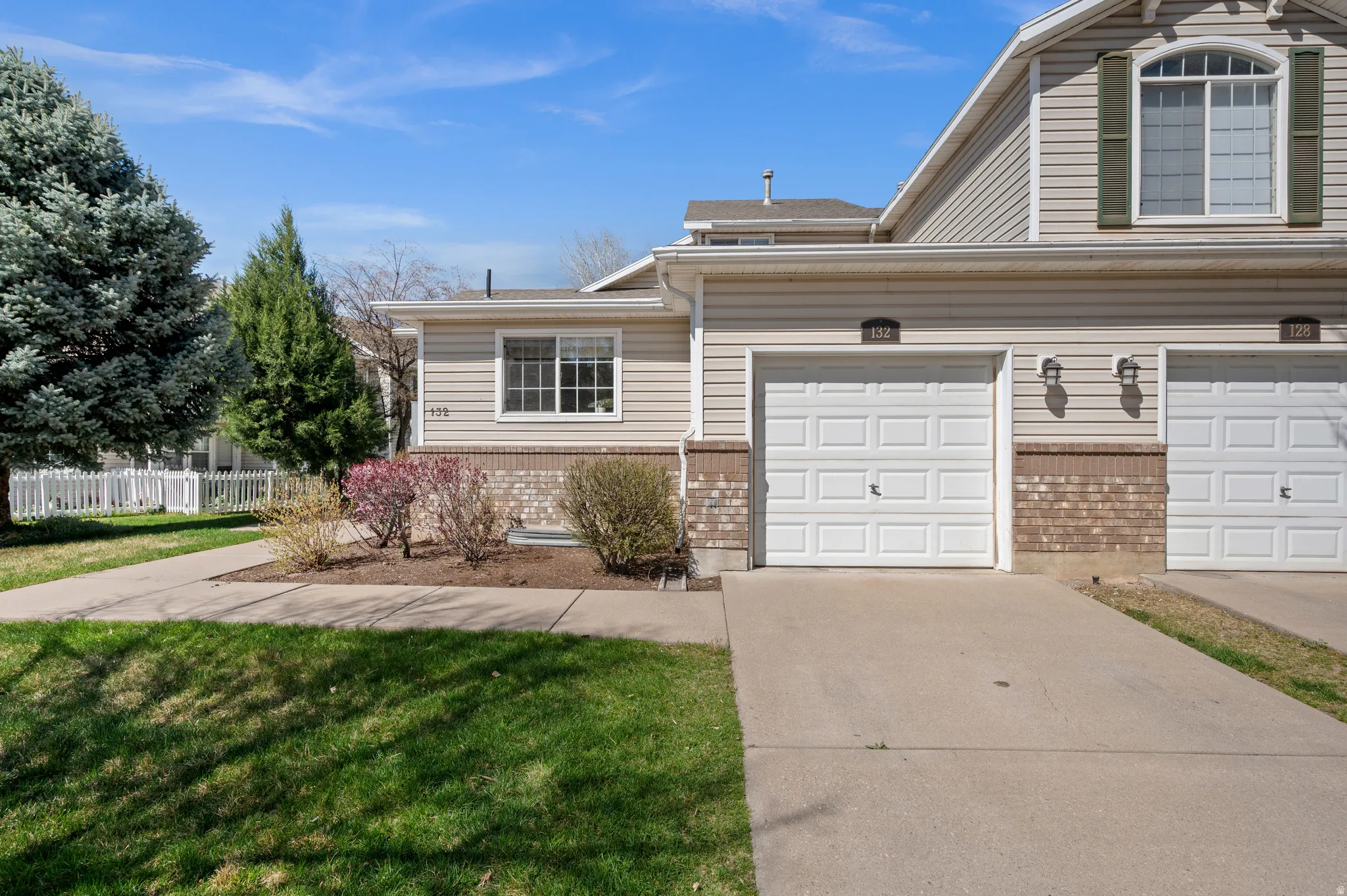 Traditional-style house featuring brick siding and driveway