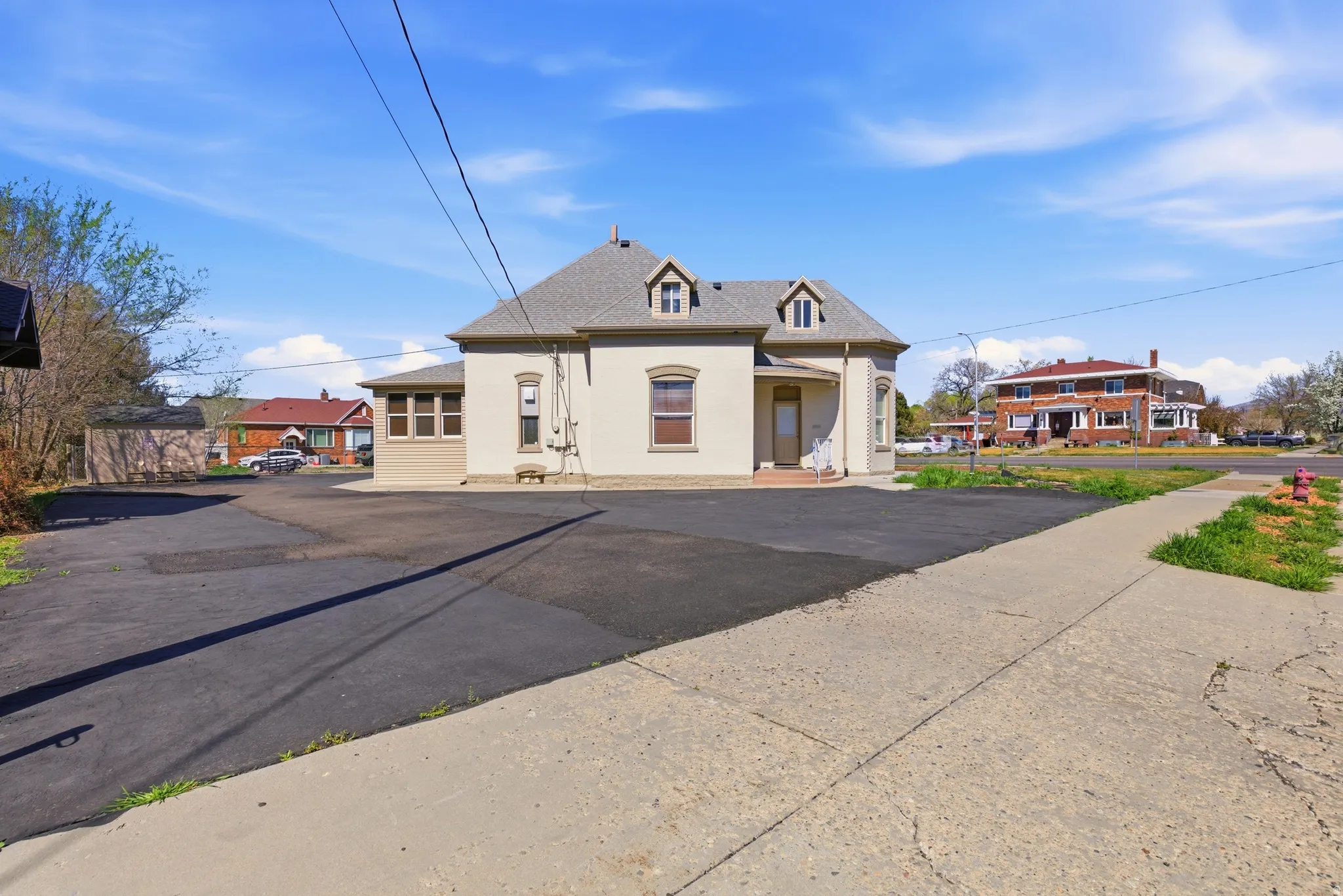 French provincial home with roof with shingles