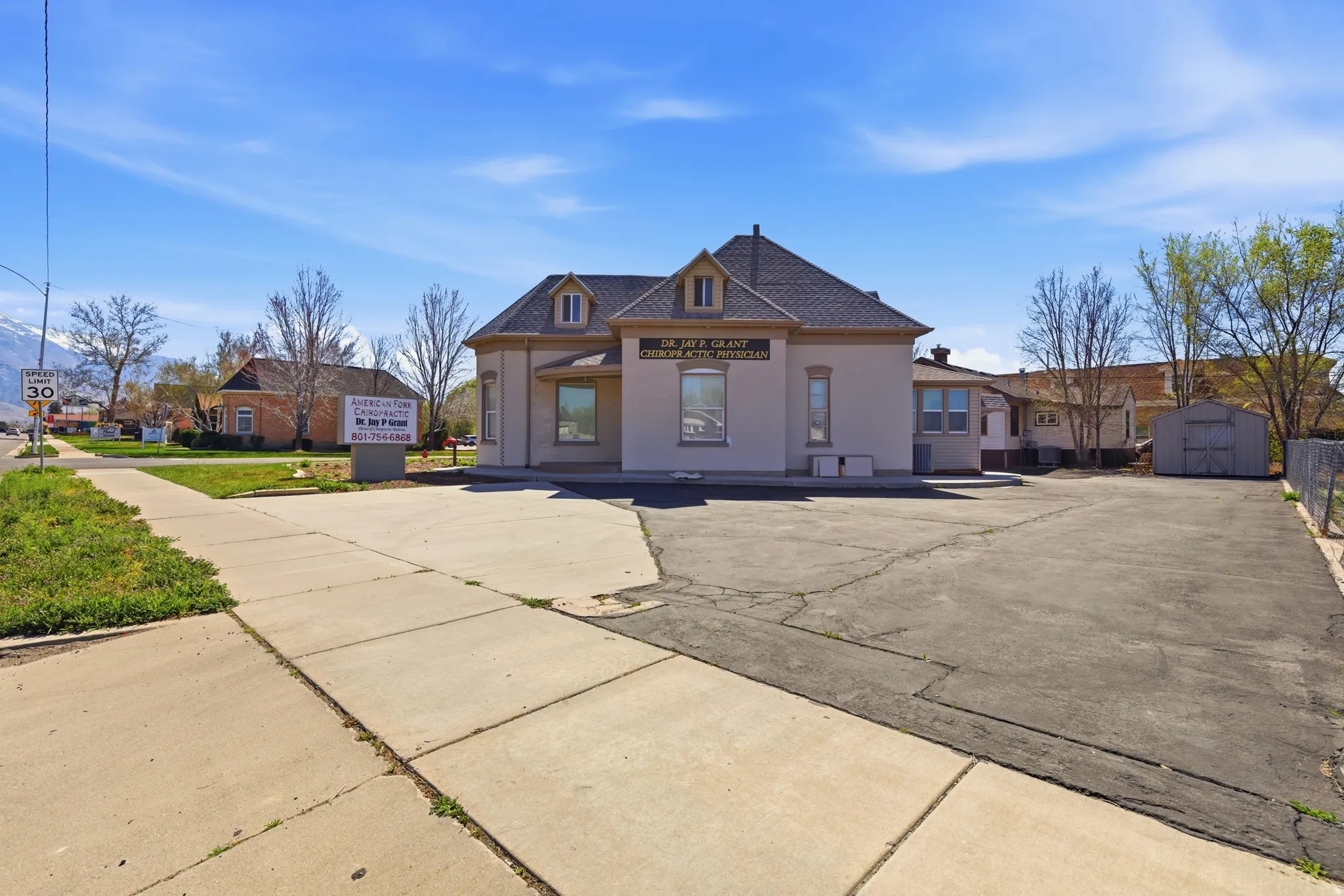 View of front of property featuring a shed
